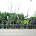 Supporters rally along a guard rail near Camp Take Notice as a means to promote awareness and raise funds for the camp during a rally along Wagner Road on Thursday.  Melanie Maxwell I AnnArbor.com